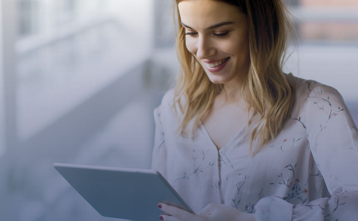 Women on tablet smiling