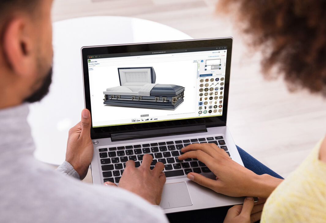 Couple reviewing Meaningful Selections on laptop